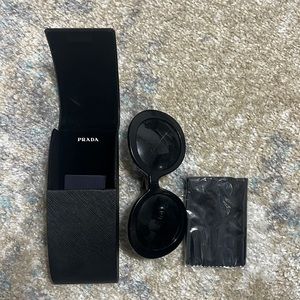 Prada sunglasses and a hard case
